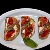 Bruschetta Con Burrata (3 Pieces) · Sun-dried tomatoes, burrata, basil, olive oil, and anchovies.