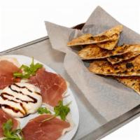 Burrata With Parma Prosciutto · Burrata with parma prosciutto and balsamic reduction, served with a side of focaccia.