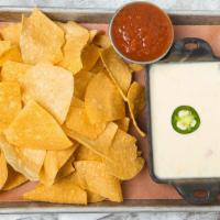 Skillet Queso · Queso dip blended with fresh jalapeños and served with fresh tortilla chips, and house-made ...