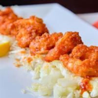 Buffalo Shrimp · Fried jumbo shrimp tossed in our homemade wing sauce served with ranch or blue cheese