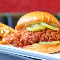 Nashville Hot Chicken · Hand-battered chicken breast with a Nashville hot sauce and served on toasted  white bread o...