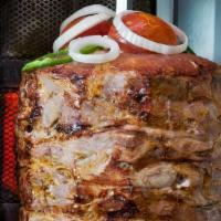 Double Gyro/ Shawarma Plate · Tender lamb and beef grilled vertically & thinly sliced served over rice and side green salad.