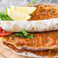 Lahmacun · A Turkish styled pizza. Flat-bread dough topped with fresh ground meat and chopped garden ve...