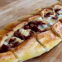 Gyro Pide · Our cheese pide topped with sliced gyro meat.