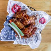 Chicken Wings · Cooked wing of a chicken coated in sauce or seasoning.