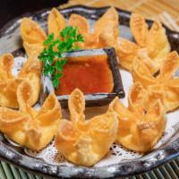 Crab Rangoon · Deep fried pastries stuffed with cream cheese and crab, wrapped in wonton skin and served wi...