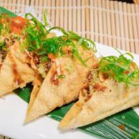 3 Pieces Spicy Tuna Taco · Crispy tacos served with chopped tuna, masago, scallion, guacamole and tempura flakes. Spicy.