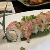Typhoon Roll · Shrimp tempura, cream cheese, scallion in and out sesame seeds and seared tuna on top with m...
