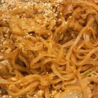 Pad Thai Noodles · Rice noodles, bean sprout, pepper, onions egg in peanut sauce. Spicy.
