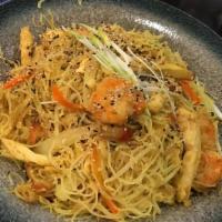 Singapore Noodles · Rice noodles, carrots, scallion, sesame seed, tossed with light curry sauce.