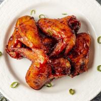 Southern Style Grilled Chicken Wings · 4 Jumbo wings of my old faithful southern recipe glazed with a mild house made sauce.