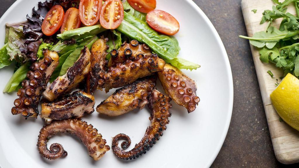 Grilled Octopus · Baby octopus, cherry tomatoes, garlic, finished in the brick oven.