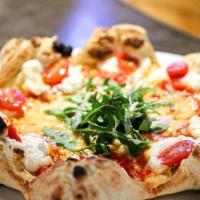 Star Pizza · Stuffed with ricotta, tomato sauce, arugula, cherry tomatoes, shaved Parmigiano.