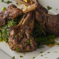 Grilled Baby Lamb Chops · Served with broccoli rabe.