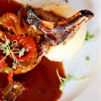 Pork Chop · Double cut, with sauteed hot vinegar peppers and mashed potatoes.