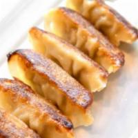 Gyoza Dumplings (6Pcs) · Six pieces of deep-­fried dumplings filled with pork, cabbage, and onions. Served with Ponzu...