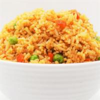 Fried Rice · Stir-­fried white rice with soy sauce, peas, carrots, and onions.