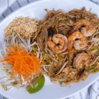 Pad Thai · Gluten free. Rice noodles, bean sprouts, green onions, and egg accompanied with crushed pean...