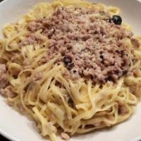 Taglierini Bolognese · family recipe made with fresh pasta and classic bolognese sauce