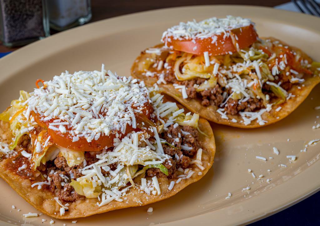 Enchiladas Hondurenas · (Orden de two) Carne molida, acompañadas con repollo, salsa, tomate y queso.