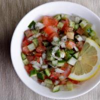 Shirazi Salad · Tomato, Persian cucumber, onion, parsley, lemon vinaigrette.
