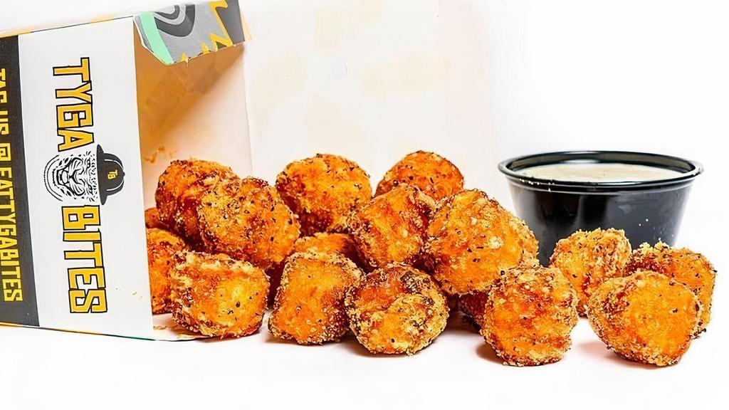 Fam Pack · Served 4-5. 32 pieces of oven-baked crispy chicken bites seasoned with your choice of dust and served with your choice of 8 dips for bites, 4 orders of tater tots, 4 dips for tots, and 4 soft drinks. If you would like multiples of a certain sauce, please indicate in the special instructions.