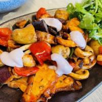 Pulpo Saltado · Sliced octopus and squid on the wok, aji panca and huacatay sauce, chimichurri sauce, potato...