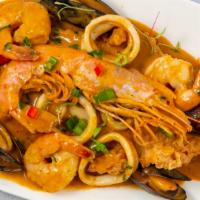 Pescado A Lo Macho · Deep fry fillet white fish topped with shrimp, calamari mussels and clams in aji amarillo an...