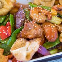 Kam Lu Wantan · Stir fry shrimp, BBQ pork, beef and chicken, seasonal vegetables, pineapple, daikon radish, ...