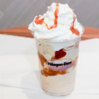 Dulce Split Dazzler Sundae · Dulce de Leche ice cream layered cream layered with bananas and warm caramel topped with whi...