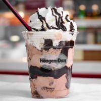 Cookies & Cream Shake · Pieces of crunchy chocolate cookies in vanilla ice cream blended and topped with whipped cre...