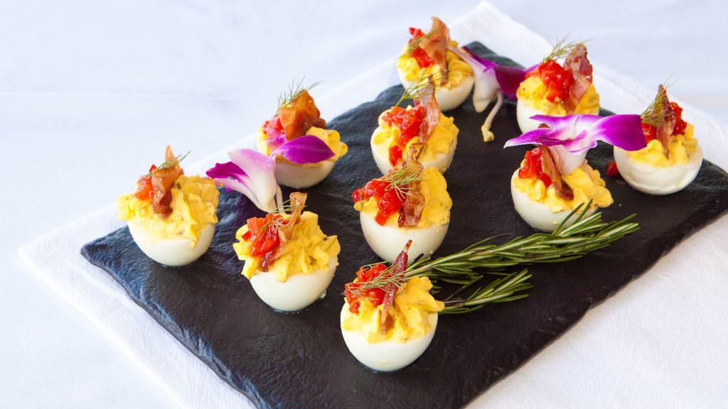 Deviled Eggs · Organic eggs/sweet pickle relish/dijon mustard/smoked paprika/mayonnaise/vermont candied bacon/red pepper jelly.