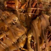 Chucky Turtle Krush · Rich chocolate chunk cookies filled with caramel and pecans drizzled with chocolate and more...