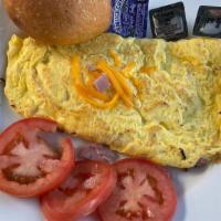 Ham & Cheese Omelette · Served with fresh rolls and home fries.