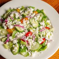 Greek Salad · Mixed greens, tomato, cucumber, onion, greek olives, feta cheese with greek dressing
