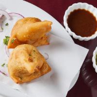 2 Pieces Samosa Vegetable · Crisp turnover, filled with mildly spiced potatoes and peas. Served with mint, onion chutney...