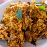 Pakora · Mixed vegetable fritters, fried, and delicately spiced. Served with mint, onion chutneys, an...