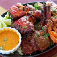 Mixed Grill · Includes chicken tandoori, chicken tikka, seekh kabab, and shrimp served with chutney, rice ...