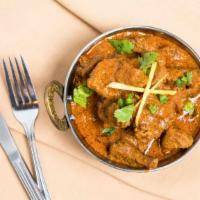 Lamb Rogan Josh · Cubes of lamb marinated in exotic spices and cooked with chopped tomatoes in a creamy sauce.