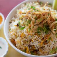 Chicken Biryani · Chicken marinated with spices and saffron, then steam-cooked with naturally fragrant Basmati...