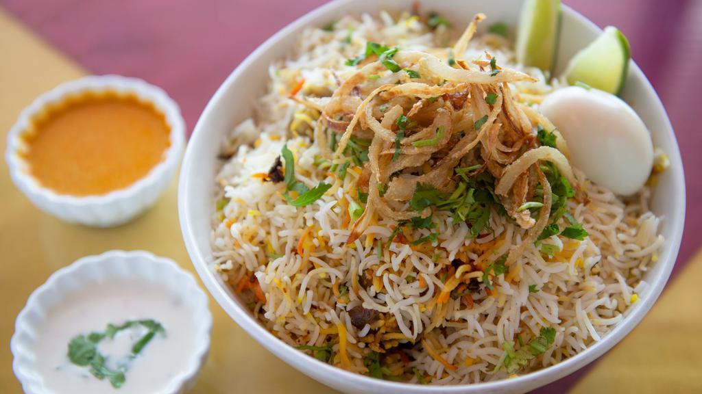 Chicken Biryani · Chicken marinated with spices and saffron, then steam-cooked with naturally fragrant Basmati rice. A classic Muglai dish.