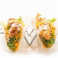 Chicken Tacos · Two chicken tacos topped with lettuce, cheese and your choice of sauce