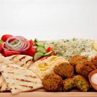 Falafel Platter · Served with Greek salad, pita bread, side of tzatziki, Greek dressing and your choice of bas...