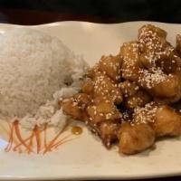Sesame Chicken · Served with steamed rice, egg roll, and a choice of soup.