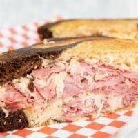 Reuben On Rye · Corned beef, swiss, sauerkraut and Russian dressing piled high on rye.