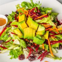 House Salad · Fresh organic in-season leafy vegetables topped with beets, carrots, radish, dried cranberri...