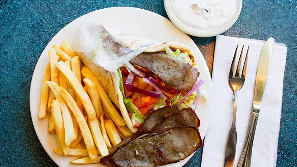 Beef Gyro Sandwich · On pita with lettuce, tomatoes, onions, and side of French fries.