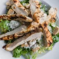 Chicken Caesar Salad · Chunks of grilled chicken breast mixed with crisp hearts of romaine lettice tossed with our ...