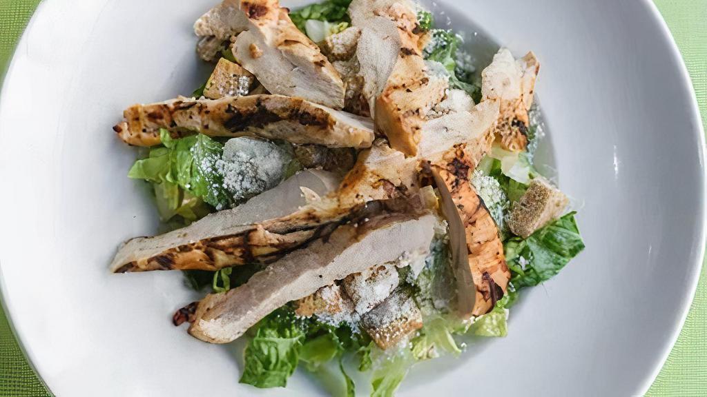 Chicken Caesar Salad · Chunks of grilled chicken breast mixed with crisp hearts of romaine lettice tossed with our special, homemade caesar dressing, homemade croutons, and shaved parmesan cheese.