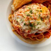 Chicken Parmesan · Fried chicken breast in tomato sauce with melted mozzarella served over penne or linguine an...
